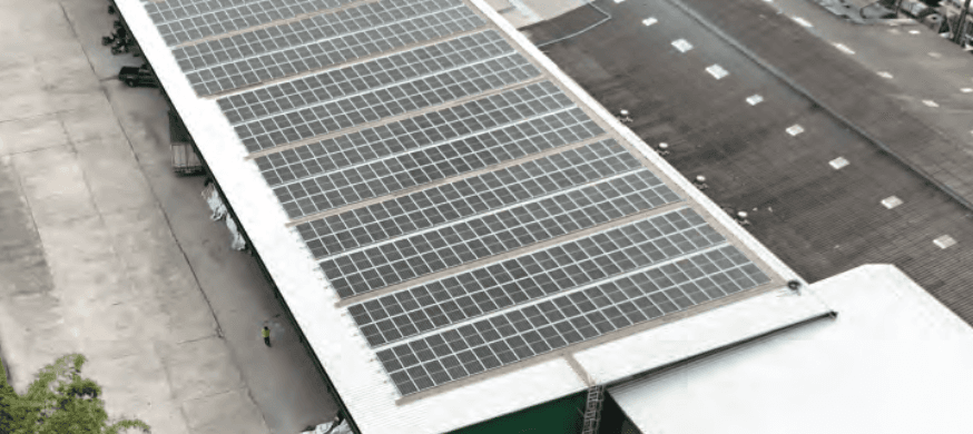 Rooftop solar panels generating clean energy on the Maruey Rubber factory roof